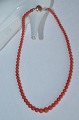 Necklace with coral pearl